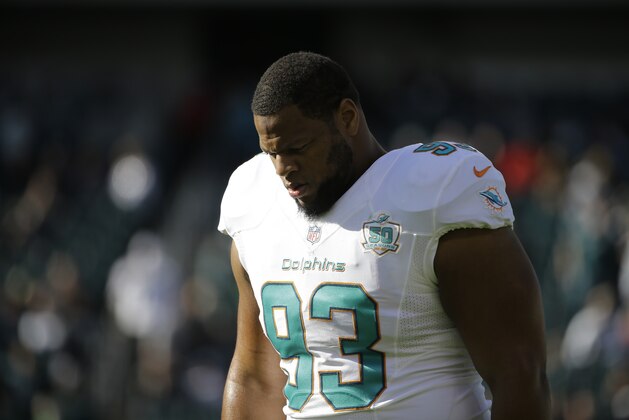 Miami Dolphins' Ndamukong Suh walks the field during warm-ups before an NFL football game against the Philadelphia Eagles, Sunday, Nov. 15, 2015, in Philadelphia. (AP Photo/Matt Rourke)