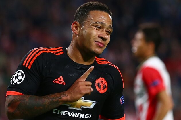 Manchester United's Memphis Depay celebrates after scoring his sides first goal during the Champions League Group B soccer match between PSV and Manchester United at Philips stadium in Eindhoven, Netherlands, Tuesday, Sept. 15, 2015. (AP Photo/Peter Dejong)