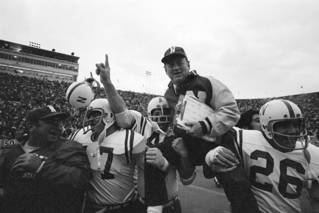University of Nebraska head coach Bob Devaney is carried off the field by his victorious players after Nebraska defeated the University of Oklahoma 35-31 at Norman, Oklahoma, Nov. 25, 1971. (AP Photo)
