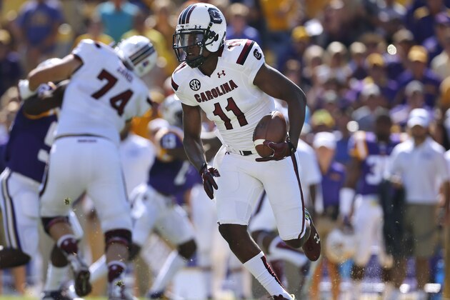 South Carolina wide receiver Pharoh Cooper (11) runs with the ball during the first half of an NCAA college football game in Baton Rouge, La., Saturday, Oct. 10, 2015. (AP Photo/Jonathan Bachman)