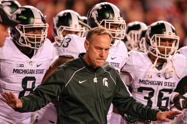 Michigan State head coach Mark Dantonio holds back his players from taking the field before an NCAA college football game against Nebraska in Lincoln, Neb., Saturday, Nov. 7, 2015. Nebraska won 39-38. (AP Photo/Nati Harnik)