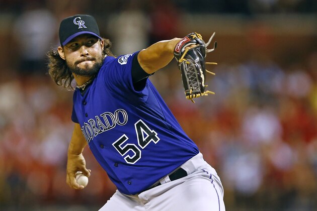 Colorado Rockies relief pitcher Tommy Kahnle throws during a baseball game against the St. Louis Cardinals, Thursday, July 30, 2015, in St. Louis. (AP Photo/Billy Hurst)