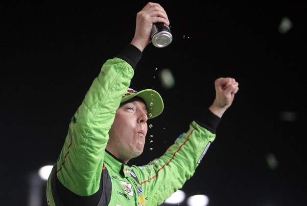 Nov 22, 2015; Homestead, FL, USA; Sprint Cup Series driver Kyle Busch (18) celebrates winning the NASCAR Spring Cup Championship after the Ford EcoBoost 400 at Homestead-Miami Speedway. Mandatory Credit: Peter Casey-USA TODAY Sports