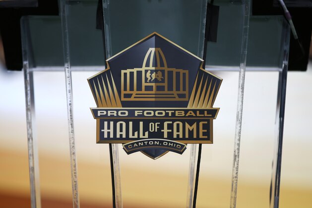 This is the Pro Football Hall of Fame logo on the podium at Tom Benson Hall of Fame Stadium that will be used for the induction ceremony for the Pro Football Hall of Fame Class of 2015 Saturday, Aug. 8, 2015, in Canton, Ohio.  (AP Photo/Gene J.Puskar)