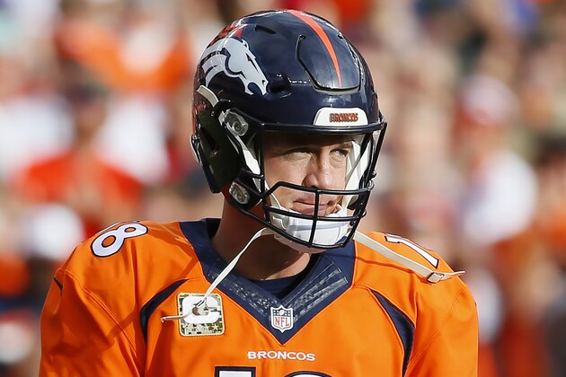 Denver Broncos quarterback Peyton Manning (18) acknowledges the crowd after setting the new passing record against the Kansas City Chiefs during the first half of an NFL football game against the, Sunday, Nov. 15, 2015, in Denver. Manning moved into first place for all-time passing yards, passing Brett Favre's record of 71,838. (AP Photo/Jack Dempsey)