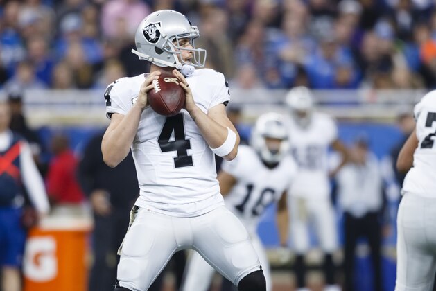 Oakland Raiders quarterback Derek Carr (4) passes against the Detroit Lions during an NFL football game at Ford Field in Detroit, Sunday, Nov. 22, 2015. (AP Photo/Rick Osentoski)