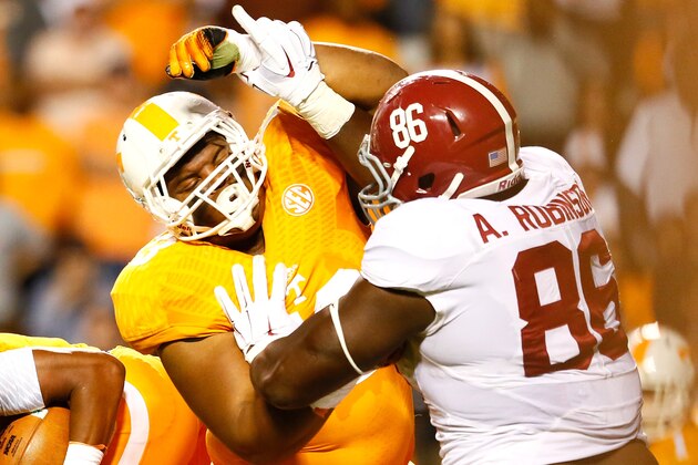 KNOXVILLE, TN - OCTOBER 25:  Jashon Robertson #73 of the Tennessee Volunteers against A'Shawn Robinson #86 of the Alabama Crimson Tide at Neyland Stadium on October 25, 2014 in Knoxville, Tennessee.  (Photo by Kevin C. Cox/Getty Images)