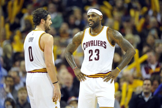 Nov 23, 2015; Cleveland, OH, USA; Cleveland Cavaliers forward Kevin Love (0) and forward LeBron James (23) react in the third quarter against the Orlando Magic at Quicken Loans Arena. Mandatory Credit: David Richard-USA TODAY Sports