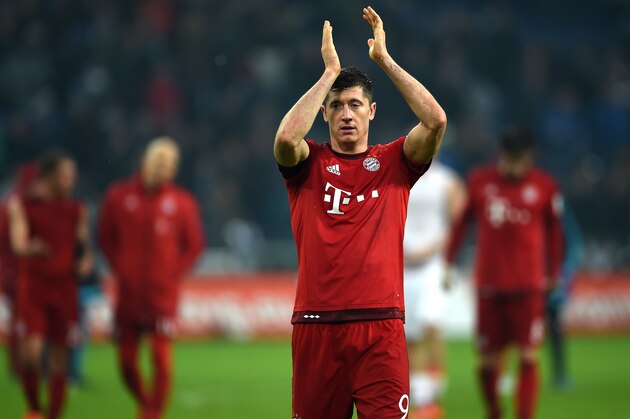 Bayern Munich's Polish striker Robert Lewandowski reacts after the German first division Bundesliga football match FC Schalke 04 vs FC Bayern Munich in Gelsenkirchen, western Germany, on November 21, 2015. Bayern Munich won the match 1-3.   AFP PHOTO / PATRIK STOLLARZ

RESTRICTIONS: DURING MATCH TIME: DFL RULES TO LIMIT THE ONLINE USAGE TO 15 PICTURES PER MATCH AND FORBID IMAGE SEQUENCES TO SIMULATE VIDEO. 
==RESTRICTED TO EDITORIAL USE ==
FOR FURTHER QUERIES PLEASE CONTACT THE DFL DIRECTLY AT + 49 69 650050.        (Photo credit should read PATRIK STOLLARZ/AFP/Getty Images)
