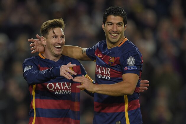 Barcelona's Argentinian forward Lionel Messi (L) and Barcelona's Uruguayan forward Luis Suarez celebrate their fourth goal during the UEFA Champions League Group E football match FC Barcelona vs AS Roma at the Camp Nou stadium in Barcelona on November 24, 2015.   AFP PHOTO/ LLUIS GENE / AFP / LLUIS GENE        (Photo credit should read LLUIS GENE/AFP/Getty Images)