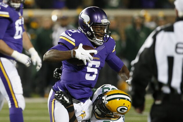 Green Bay Packers defensive end Datone Jones (95) sacked Minnesota Vikings quarterback Teddy Bridgewater (5) during the second half of an NFL football game in Minneapolis, Sunday, Nov. 22, 2015. (AP Photo/Ann Heisenfelt)