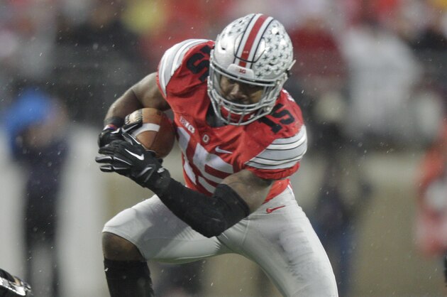Ohio State running back Ezekiel Elliott (15) runs the ball against Michigan State during the first quarter of an NCAA college football game Saturday, Nov. 21, 2015, in Columbus, Ohio. Michigan State beat Ohio State 17-14. (AP Photo/Jay LaPrete)