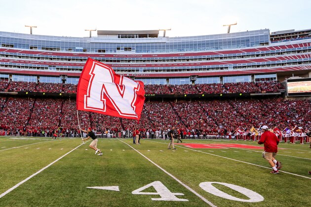A large Nebraska flag is run across the field before an NCAA college football game between Nebraska and South Alabama in Lincoln, Neb., Saturday, Sept. 12, 2015. Nebraska won 48-9. (AP Photo/Nati Harnik)