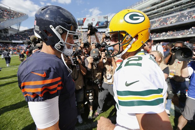 Chicago Bears quarterback Jay Cutler (6) and Green Bay Packers quarterback Aaron Rodgers (12) during the second half an NFL football game, Sunday, Sept. 13, 2015, in Chicago. The Packers won 31-23. (AP Photo/Charles Rex Arbogast) Chicago Bears quarterback Jay Cutler (6) and Green Bay Packers quarterback Aaron Rodgers (12) during the second half an NFL football game, Sunday, Sept. 13, 2015, in Chicago. The Packers won 31-23. (AP Photo/Charles Rex Arbogast)