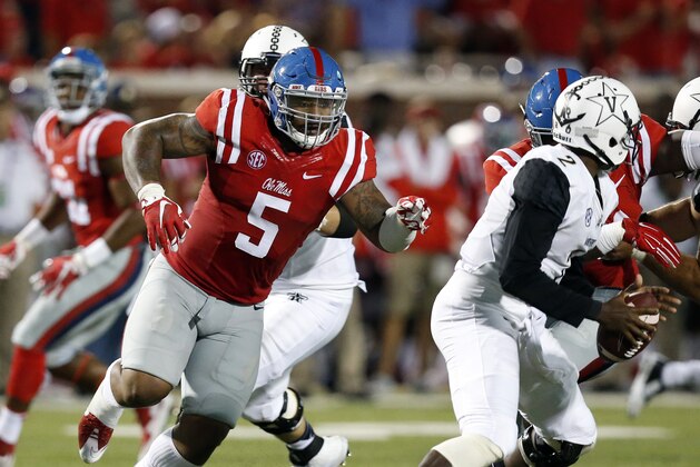 Mississippi defensive tackle Robert Nkemdiche (5) pursues Vanderbilt quarterback Johnny McCrary (2) during the first half of an NCAA college football game Saturday, Sept. 26, 2015, in Oxford, Miss. (AP Photo/Rogelio V. Solis)