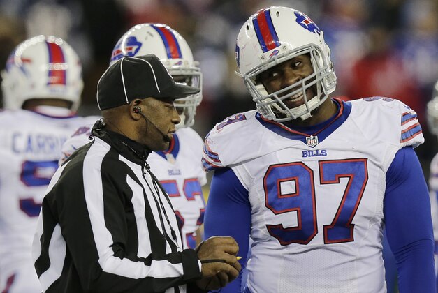 Umpire Barry Anderson speaks to Buffalo Bills defensive tackle Corbin Bryant in the second half of an NFL football game between the Bills and the New England Patriots, Tuesday, Nov. 24, 2015, in Foxborough, Mass. (AP Photo/Charles Krupa)