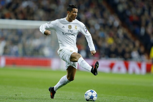 Real Madrid's Cristiano Ronaldo controls the ball during the Champions League group A soccer match between Real Madrid and PSG at the Santiago Bernabeu stadium in Madrid, Tuesday, Nov. 3, 2015. (AP Photo/Francisco Seco)