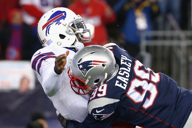 FOXBORO, MA - NOVEMBER 23:  Tyrod Taylor #5 of the Buffalo Bills is tackled by Dominique Easley #99 of the New England Patriots during the first quarter at Gillette Stadium on November 23, 2015 in Foxboro, Massachusetts.  (Photo by Jim Rogash/Getty Images)