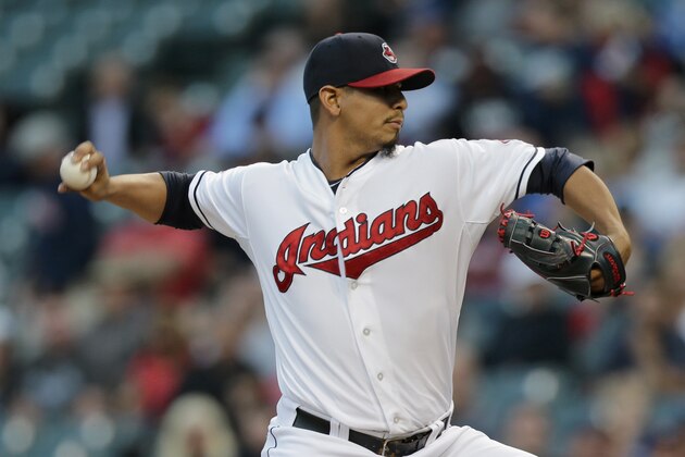 Cleveland Indians starting pitcher Carlos Carrasco delivers in the first inning of a baseball game against the Kansas City Royals, Monday, Sept. 14, 2015, in Cleveland. (AP Photo/Tony Dejak)