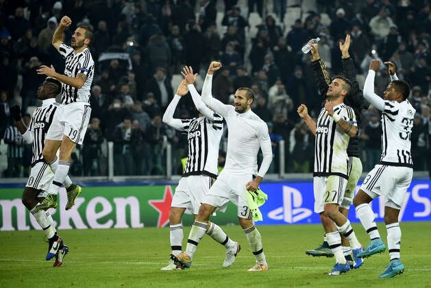 Juventus players celebrate with fans after winning 1-0 the UEFA Champions League football match Juventus vs Manchester City on November 25, 2015 at the Juventus Stadium in Turin.        AFP PHOTO / OLIVIER MORIN / AFP / OLIVIER MORIN        (Photo credit should read OLIVIER MORIN/AFP/Getty Images)