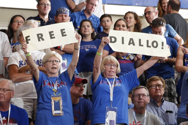 Nov 23, 2015; Lahaina, HI, USA; Kansas Jayhawks fans hold up signs for the NCAA to declare Kansas forward Cheick Diallo eligible to play against the Chaminade Silverswords at the Lahaina Civic Center during the Maui Jim Maui Invitational at the Lahaina Civic Center. Mandatory Credit: Brian Spurlock-USA TODAY Sports