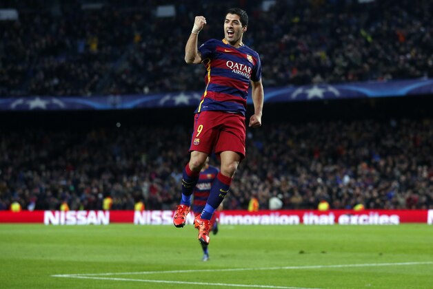 Barcelona's Luis Suarez celebrates after scoring his side's third goal during the Group E Champions League soccer match between Barcelona and Roma at the Camp Nou stadium in Barcelona, Spain, Tuesday Nov. 24, 2015. (AP Photo/Manu Fernandez)