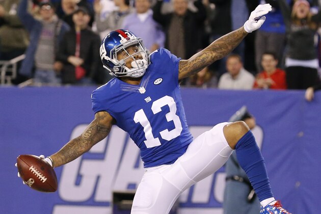 New York Giants wide receiver Odell Beckham celebrates after scoring a touchdown during the first half of an NFL football game against the New England Patriots Sunday Nov. 15, 2015, in East Rutherford, N.J. (AP Photo/Julio Cortez)