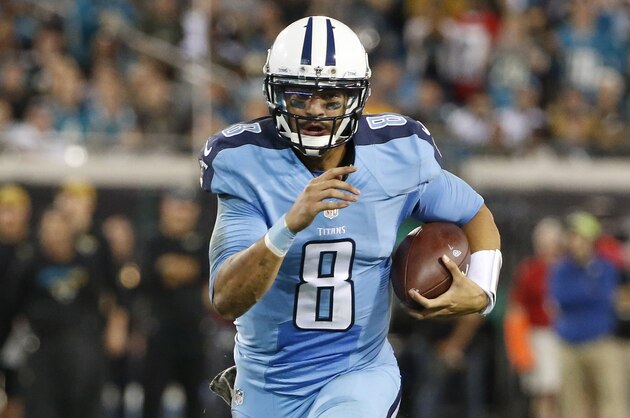 Tennessee Titans quarterback Marcus Mariota (8) runs 23-yards for a touchdown against the Jacksonville Jaguars during the third quarter of an NFL football game Thursday, Nov. 19, 2015, in Jacksonville, Fla. (AP Photo/Brian Blanco)