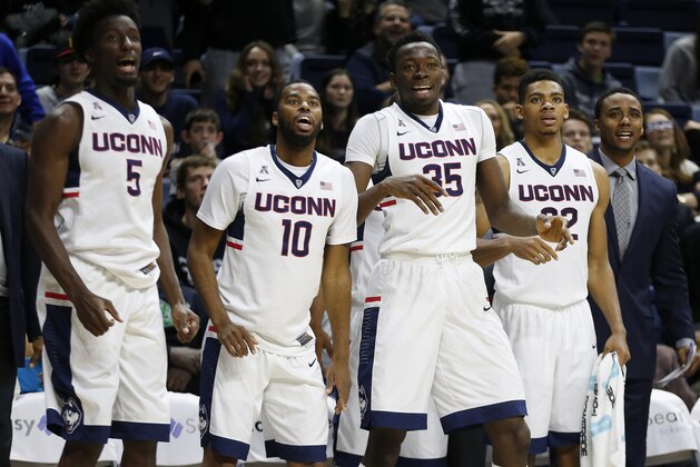 Connecticut's Daniel Hamilton (5), Sam Cassell Jr. (10), Amida Brimah (35) and Shonn Miller (32) during the second half of an NCAA college basketball game against Furman in Storrs, Conn., Saturday, Nov. 21, 2015. Connecticut won 83-58. (AP Photo/Michael Dwyer)