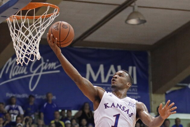 Kansas guard Wayne Selden Jr. (1) goes to the basket over Vanderbilt forward Jeff Roberson during the first half during an NCAA college basketball game in the Maui Invitational on Wednesday, Nov. 25, 2015, in Lahaina, Hawaii. (AP Photo/Rick Bowmer)
