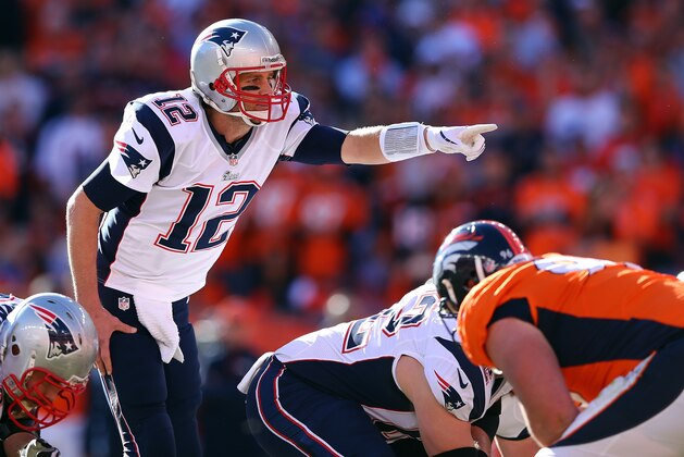 DENVER, CO - JANUARY 19:  Tom Brady #12 of the New England Patriots in action against the Denver Broncos during the AFC Championship game at Sports Authority Field at Mile High on January 19, 2014 in Denver, Colorado.  (Photo by Elsa/Getty Images)