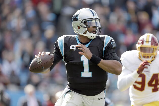 The Carolina Panthers' Cam Newton (1) scrambles and tries to throw as the Washington Redskins' Preston Smith (94) makes chase during the first half of an NFL football game in Charlotte, N.C., Sunday, Nov. 22, 2015. The Panthers won 44-16. (AP Photo/Bob Leverone)