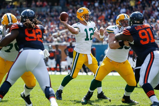 CHICAGO, IL - SEPTEMBER 13:  Quarterback Aaron Rodgers #12 of the Green Bay Packers passes for 1 yard resulting in a  touchdown against the Chicago Bears in the third quarter at Soldier Field on September 13, 2015 in Chicago, Illinois.  (Photo by Wesley Hitt/Getty Images)