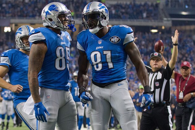 DETROIT, MI - OCTOBER 25: Calvin Johnson #81 of the Detroit Lions celebrates a first quarter touch down with teammate Eric Ebron #85 while playing the Minnesota Vikings during an NFL game at Ford Field on October 25, 2015 in Detroit, Michigan. (Photo by Dave Reginek/Getty Images)