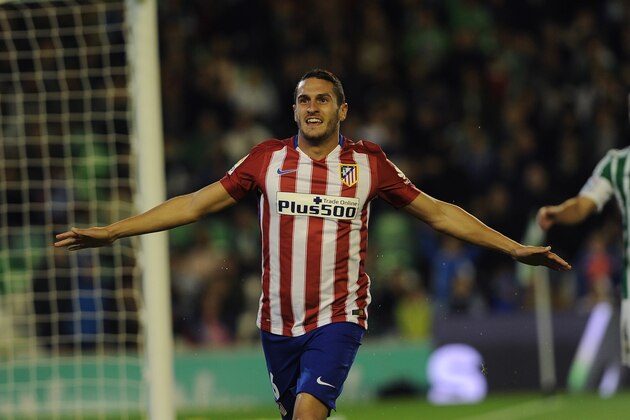 Atletico Madrid's midfielder Koke celebrates after scoring a goal during the Spanish league football match Real Betis Balompie vs Club Atletico de Madrid at the Benito Villamarin stadium in Sevilla on November 22, 2015.  AFP PHOTO / CRISTINA QUICLER        (Photo credit should read CRISTINA QUICLER/AFP/Getty Images)