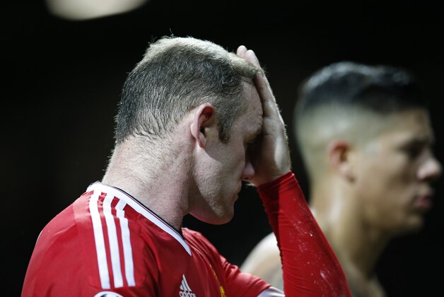 Manchester United's Wayne Rooney reacts after the Champions League group B soccer match between Manchester United and PSV Eindhoven at Old Trafford Stadium in Manchester, England, Wednesday, Nov. 25, 2015. The match ended 0-0. (AP Photo/Jon Super)