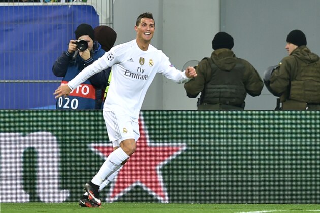 Real Madrid's Portuguese forward Cristiano Ronaldo celebrates after scoring during the UEFA Champions League group A football match between Shakhtar Donetsk and Real Madrid in Lviv on November 25, 2015.   AFP PHOTO / SERGEI SUPINSKY / AFP / SERGEI SUPINSKY        (Photo credit should read SERGEI SUPINSKY/AFP/Getty Images)