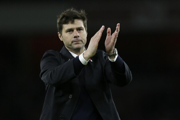 Tottenham manager Mauricio Pochettino applauds the fans after the English Premier League soccer match between Arsenal and Tottenham Hotspur at the Emirates Stadium in London, Sunday Nov. 8, 2015. (AP Photo/Tim Ireland)