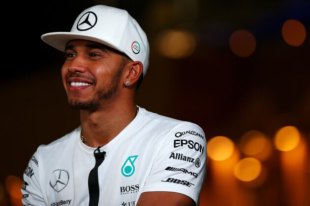 ABU DHABI, UNITED ARAB EMIRATES - NOVEMBER 26:  Lewis Hamilton of Great Britain and Mercedes GP speaks with members of the media in the paddock during previews for the Abu Dhabi Formula One Grand Prix at Yas Marina Circuit on November 26, 2015 in Abu Dhabi, United Arab Emirates.  (Photo by Mark Thompson/Getty Images)