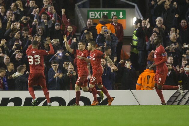 Liverpool's James Milner, centre left, celebrates with teammates after scoring fro the penalty spot during the Europa League Group B soccer match between Liverpool and  Bordeaux at Anfield Stadium, Liverpool, England, Thursday Nov. 26, 2015. (AP Photo/Jon Super)