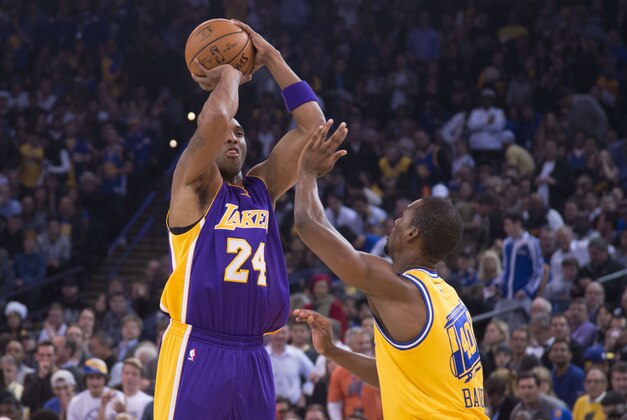 November 24, 2015; Oakland, CA, USA; Los Angeles Lakers forward Kobe Bryant (24) shoots the basketball against Golden State Warriors forward Harrison Barnes (40) during the first quarter at Oracle Arena. Mandatory Credit: Kyle Terada-USA TODAY Sports