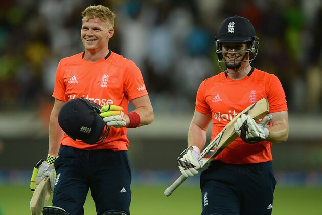 DUBAI, UNITED ARAB EMIRATES - NOVEMBER 26:  Sam Billings leaves the field alongside England captain Eoin Morgan after their innings during the 1st International T20 match between Pakistan and England at Dubai Cricket Stadium on November 26, 2015 in Dubai, United Arab Emirates.  (Photo by Gareth Copley/Getty Images)