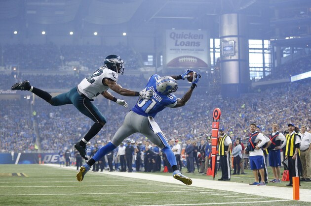Detroit Lions wide receiver Calvin Johnson (81), defended by Philadelphia Eagles cornerback Eric Rowe (32) catches a pass for a touchdown during the second half of an NFL football game, Thursday, Nov. 26, 2015, in Detroit. (AP Photo/Rick Osentoski)
