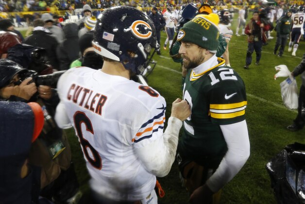 Chicago Bears quarterback Jay Cutler talks to Green Bay Packers quarterback Aaron Rodgers after an NFL football game Thursday, Nov. 26, 2015, in Green Bay, Wis. The Bears won 17-13. (AP Photo/Mike Roemer)