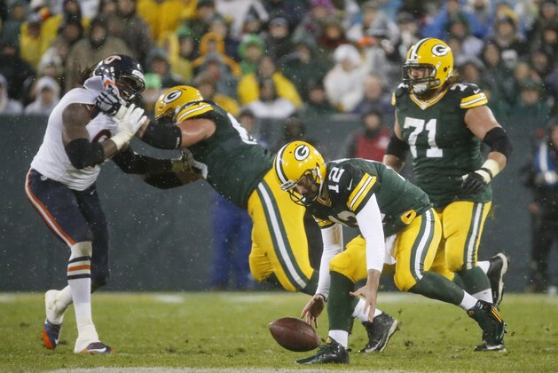 Green Bay Packers' Aaron Rodgers recovers a fumble during the second half of an NFL football game against the Chicago Bears Thursday, Nov. 26, 2015, in Green Bay, Wis. (AP Photo/Mike Roemer) Green Bay Packers' Aaron Rodgers recovers a fumble during the second half of an NFL football game against the Chicago Bears Thursday, Nov. 26, 2015, in Green Bay, Wis. (AP Photo/Mike Roemer)