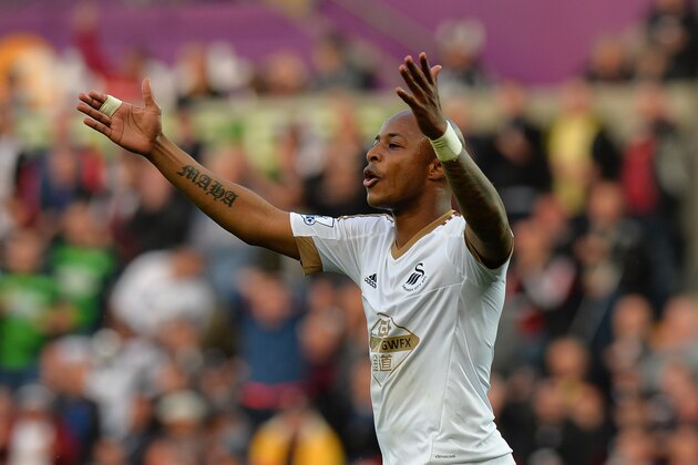 Andre Ayew of Swansea City protests the linesmans decision during the Barclays Premier League match between Swansea City and Arsenal at Liberty Stadium on October 31, 2015 in Swansea, Wales.