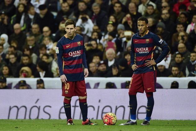 Barcelona's Argentinian forward Lionel Messi (L) and Barcelona's Brazilian forward Neymar stand during the Spanish league 'Clasico' football match Real Madrid CF vs FC Barcelona at the Santiago Bernabeu stadium in Madrid on November 21, 2014.   AFP PHOTO / PIERRE-PHILIPPE MARCOU        (Photo credit should read PIERRE-PHILIPPE MARCOU/AFP/Getty Images)