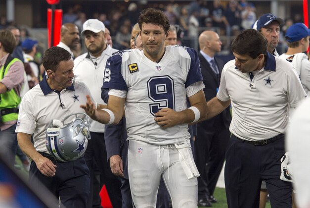 Nov 26, 2015; Arlington, TX, USA; Dallas Cowboys quarterback Tony Romo (9) leaves the game with an injury during the second half of an NFL game against the Carolina Panthers on Thanksgiving at AT&T Stadium. Mandatory Credit: Jerome Miron-USA TODAY Sports