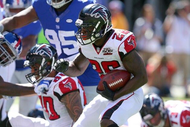 Atlanta Falcons running back Tevin Coleman #26 runs for a touchdown against the New York Giants during an NFL game at MetLife Stadium in East Rutherford, N.J. on Sunday, Sept. 20, 2015. (AP Photo/Brad Penner)