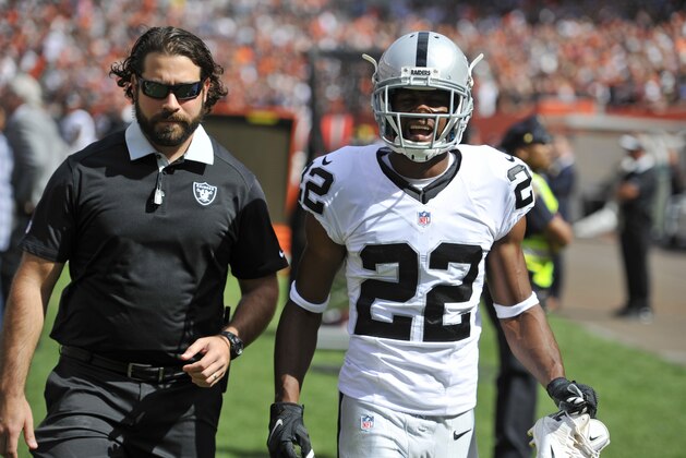 Oakland Raiders running back Taiwan Jones (22) walks off the field during the first half of an NFL football game against the Cleveland Browns, Sunday, Sept. 27, 2015, in Cleveland. (AP Photo/David Richard)